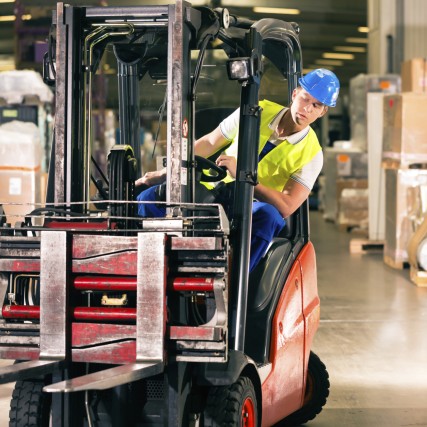 forklift driver at warehouse of forwarding